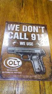 Colt We Don�t Call 911 Metal Sign.