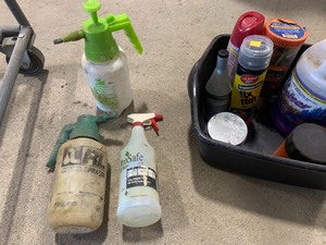 Box of degreasers and spray bottles