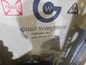 lot 75 image: Glass Warehouse 36.5 in. x 78 in. Frameless Fixed Shower Door in Polished Brass without Handle