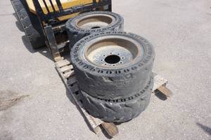 Set of 4  - Construction Pro Solid Skid Loader Tires on 8 Bolt Rims