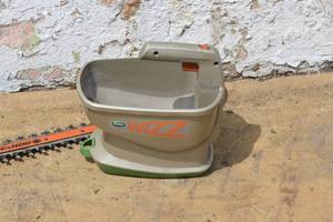 lot 6 image: Black and Decker Hedge Clipper and Battery Operated seed spreader