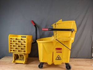 lot 82 image: Rubbermaid WaveBrake Mop Bucket with (2) Side Press Wringers, Yellow - X
