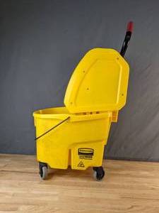 lot 77 image: Rubbermaid WaveBrake Mop Bucket with Down Press Wringer, Yellow - X