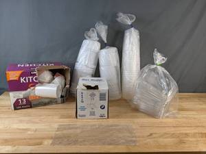 lot 186 image: Assortment of Kitchen 13 Gallon Trash Bags, Food Storage Bags,  Plastic Lids and More - X