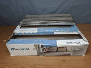 lot 30 image: Boxes of Lifeproof Shadow Wood 6 in. x 24 in. Porcelain Floor and Wall Tile - X