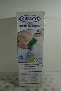 lot 34 image: NEW Graco Crib and Toddler Deluxe Mattress