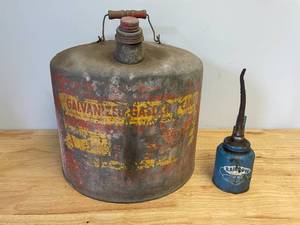 lot 28 image: Vintage Metal Gasoline Can and Rainbow Brand Pump Oiler