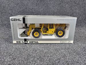 lot 103 image: GEHL DL-6L Dynalift Telehandler Diecast Model - 125 Scale - Comes with Bucket and Forks