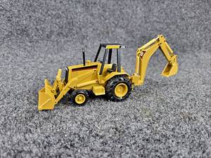 lot 114 image: NZG  Caterpillar 416B Backhoe Loader 150 Diecast Model - Made in West Germany