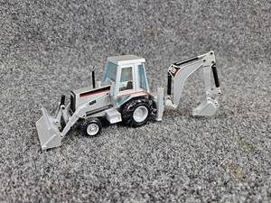 lot 115 image: NZG  Caterpillar 428B Backhoe Loader 150 Diecast Model - Made in West Germany