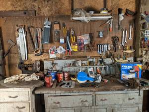lot 156 image: Garage Work Table with Large Assortment of Tools Wrenches, Saws, Screw Drivers, Cable Ties, Nails, Screws and Much More