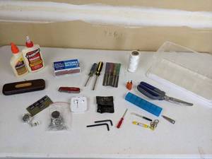lot 123 image: Junk Drawer Treasures Apple Earbuds, Wood Glue, Tools, Scissors, Pocket Knife