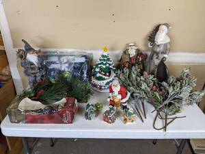 lot 175 image: Assortment of Christmas Decorations Village Houses, Floral Arrangements, Free Standing Santas, Ornaments and More