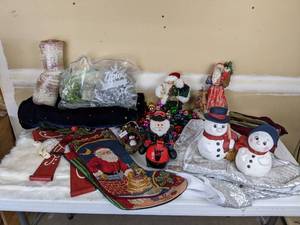 lot 179 image: Assortment of Christmas Decorations Stockings, Free Standing Santas, Snowmen, Ribbon, Ornaments, Jingle Bells and More