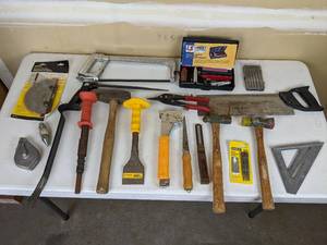 lot 108 image: Assorted Construction Hand Tools (Chalk Line Reel, Remington Powder Actuated Tool, Hammer Tacker, Various Hammers and Saws, Sharpeners, and more)