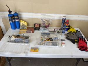 lot 120 image: Assorted DIYHome Improvement Items (WD-40, Propane, Powerbuilt Screw Extractors, Hex Nuts, Hanging Chain, Work Gloves, and more)