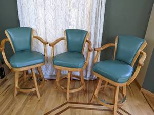 lot 13 image: Set of (3) Teal Leather Bar Stool Chairs w Armrests