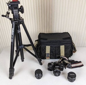 lot 70 image: Minolta X-700 Camera, 2 Additional Lenses, Camera Bag, and Velbon S-400 Tripod