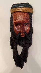 lot 166 image: Wooden, Hand-Carved Wall Sculpture of a Jamaican Man