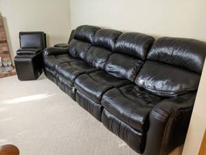 lot 15 image: Reclining Black Leather Couch with Consoles