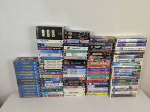 lot 69 image: 100 VHS Collection (Star Wars, Shrek, Richard Simmons, Titanic, Disney, Sports, Jurassic Park, Mighty Machines Series, and more)