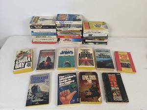 lot 73 image: Assortment of 40 Vintage Paperback Novels (Jaws, The Hitchhikers Guide to the Galaxy, Star Trek, Brians Song, Planet of the Apes, and more)