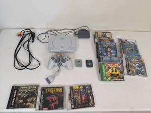 lot 74 image: Sony Playstation PS One with Memory Cards and 13 Games