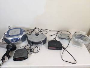 lot 83 image: Assortment of (7) Small Appliances (Clock Radios, Hair Dryers, CD Players, Fan)