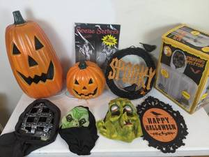 lot 64 image: Halloween Decor - Light Up Jack-o-lanterns, Spooky Masks, Skeleton, and more