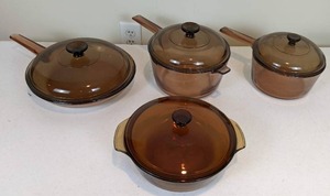 lot 148 image: Vintage 8-Piece Collection of Amber Colored Glass Cookware and Bakeware by Vision Corning and Anchor Hocking