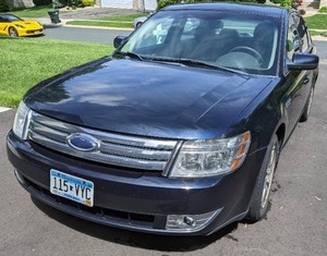 lot 1 image: Great Condition 4-Door 2009 Ford Taurus Navy  Beige 152,000 Miles