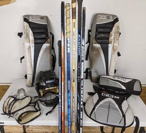 lot 42 image: Junior Size Hockey Equipment Includes Pads, Helmet and 6 Hockey Sticks (Bauer, Easton, Nike, and More)