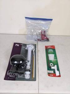 lot 220 image: Collection of Toilet Accessories Plumb Works Adjustable Anti-Siphon Toilet Repair Kit, Fluidmaster Toilet Tank Lever and More