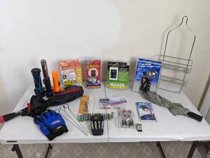 lot 222 image: Assortment of Miscellaneous Accessories Duracell AA Battery Charger, Rugged Wear Gloves, Travel Padlock, Pitstop 12V Mini Spotlight, Battery Minder, Jupiter Jack, Eggies, Flashlights and More