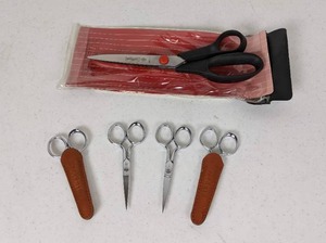 lot 162 image: Lot of 5 Pairs of Scissors Mundial Pinking Shears, 4 Pair Gingher Scissors (2 with Leather Sheaths)