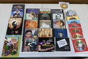 lot 213 image: Collection of DVDs and CDs Elvis Presley, Lawrence Welk, Mannheim Steamroller, Happy Feet, Super Mario Bros and More