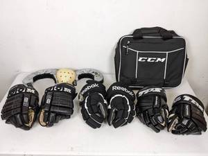 lot 64 image: Assortment of Hockey Gear Gloves, Elite Hockey Skate Guard, CCM Carry Bag and More