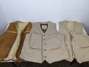 lot 293 image: Trio of Mens Vests Orvis Zamiezi Twill, Eddie Bauer Leather Shearling, The Territory Ahead LinenSilk