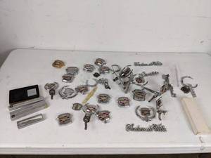 lot 387 image: Collection of Cadillac Vehicle Badges and Trinkets
