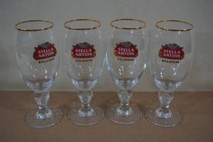 lot 160 image: Vintage Gold Rim Stella Artois Glasses