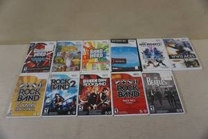 lot 271 image: Nintendo Wii Games - Green Day, Aerosmith, Beatles