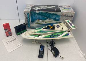 lot 13 image: Vintage RadioShack Tsunami RC Boat