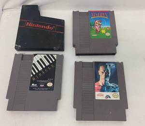 lot 29 image: Vintage NES Games Including Miracle, Nes Open Golf And T2