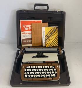 lot 38 image: Vintage SCM Smith-Corona Classic 12 Typewriter With Case And More.