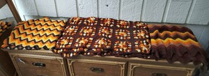 lot 213 image: Three Vintage Afghan Blankets- Orange & Brown