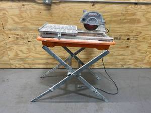 lot 50 image: RIDGID 6.5 Amp Corded 7 in. Table Top Wet Tile Saw with Stand