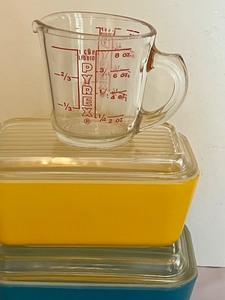 lot 115 image: Two Pyrex Covered Fridgies and a Measuring Cup