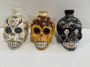 3 Empty Skull Tequila Bottles