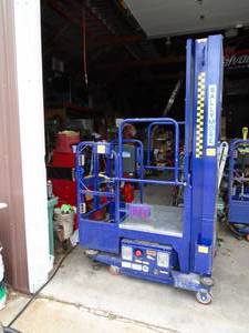 Ballymore PS150L man lift with battery & charger. Works going up. Will need down solenoid replaced but can drop down manually. As shown.
