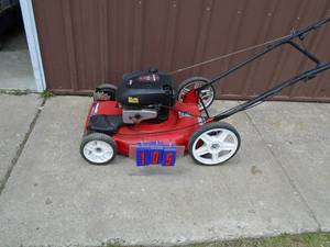 Poulan self propelled lawn mower. Big rear wheels. Tested & works. As shown.